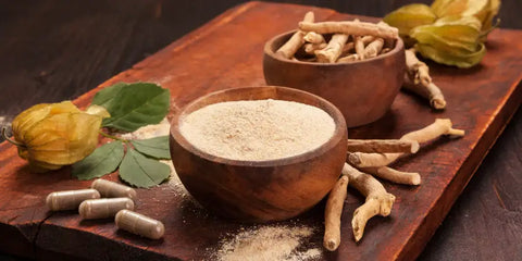 ashwagandha and some pills on a wooden table