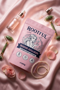 ROOTFUL Marine Kollagen Hydrolyzed Peptides 300g pink pouch with jade roller, rose serum, pearl bracelet and rose petals on pink silk