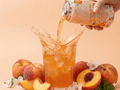 Prebiotic peaches drink can Pouring in glass
