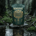 ROOTFUL Superblend greens and superfoods powder 300g dark green pouch on mossy forest rock in rain with water ripples and reflection
